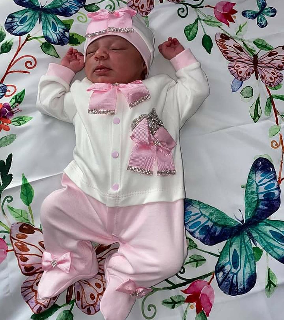Super luxurious playsuit with diamond crown and beautiful pink bows.